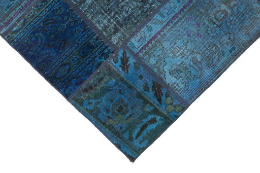 Backside of handmade 1960s Patchwork rug showing knot structure and weave density