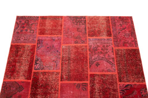 Surface texture of 1960s Patchwork rug with natural Wool and intricate pattern