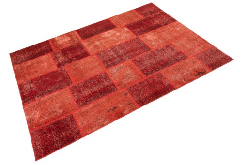 Corner detail of 1960s Patchwork rug showing border pattern and Wool pile
