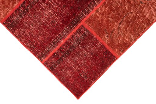 Surface texture of 1960s Patchwork rug with natural Wool and intricate pattern