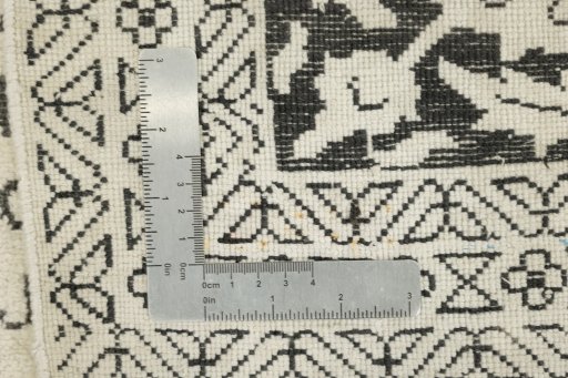 Corner detail of 1990s Vintage rug showing border pattern and Silk pile