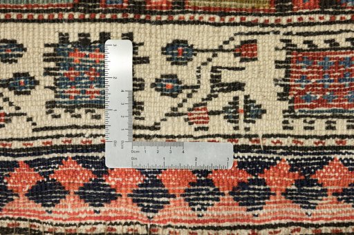 Corner detail of 1900s Vintage rug showing border pattern and Wool pile