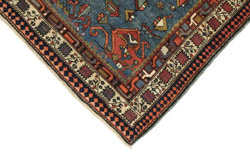 Backside of handmade 1900s Vintage rug showing knot structure and weave density