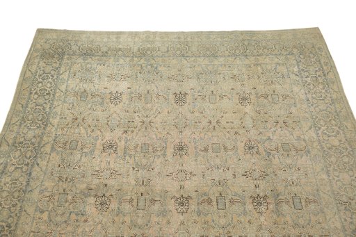 Surface texture of 1920s Vintage rug with natural Wool and intricate pattern