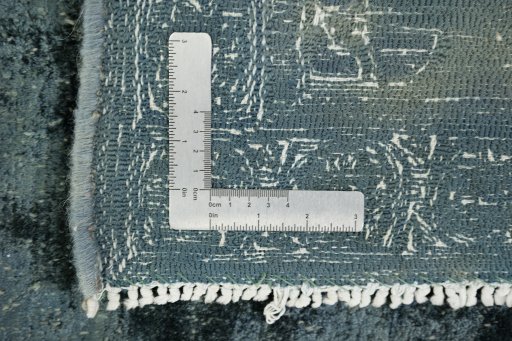 Corner detail of 1940s Vintage rug showing border pattern and Wool pile
