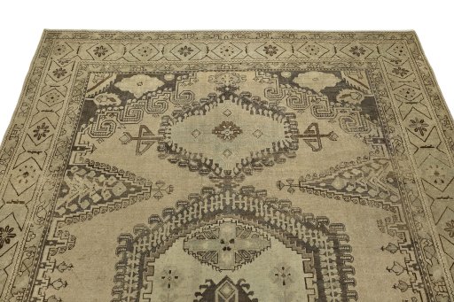 Surface texture of 1940s Vintage rug with natural Wool and intricate pattern