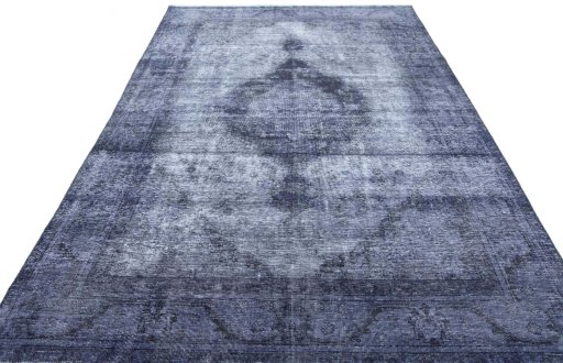 Surface texture of 1970s Vintage rug with natural Wool and intricate pattern