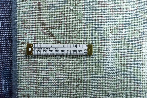 Backside of handmade 1970s Vintage rug showing knot structure and weave density
