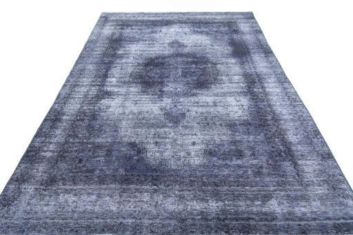 Surface texture of 1970s Vintage rug with natural Wool and intricate pattern
