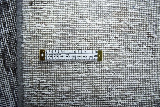 Backside of handmade 1970s Vintage rug showing knot structure and weave density