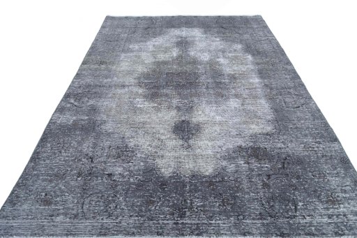 Surface texture of 1970s Vintage rug with natural Wool and intricate pattern