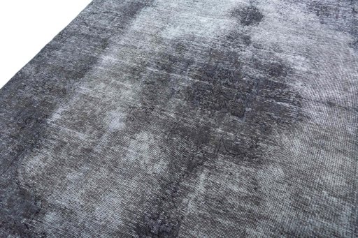 Backside of handmade 1970s Vintage rug showing knot structure and weave density