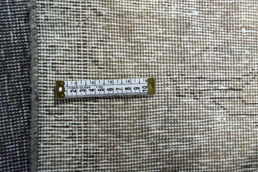 Backside of handmade 1970s Vintage rug showing knot structure and weave density