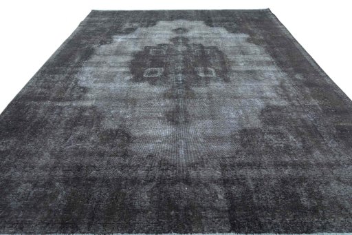 Surface texture of 1970s Vintage rug with natural Wool and intricate pattern