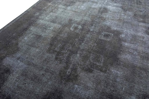 Backside of handmade 1970s Vintage rug showing knot structure and weave density