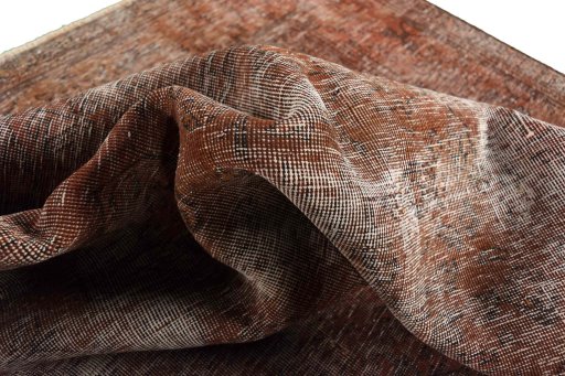 Surface texture of 1970s Vintage rug with natural Wool and intricate pattern