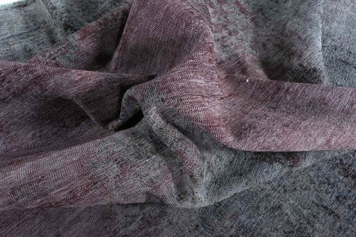 Surface texture of 1970s Vintage rug with natural Wool and intricate pattern