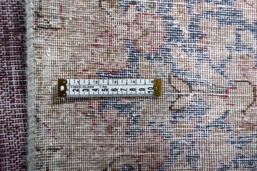 Backside of handmade 1970s Vintage rug showing knot structure and weave density