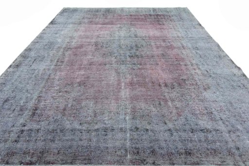 Surface texture of 1970s Vintage rug with natural Wool and intricate pattern