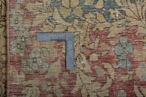 Backside of handmade 1950s Vintage rug showing knot structure and weave density