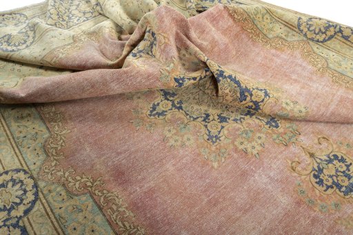 Surface texture of 1950s Vintage rug with natural Wool and intricate pattern