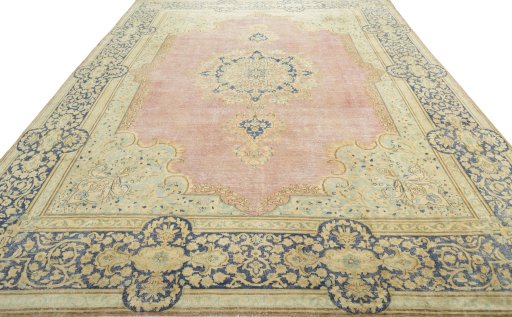 Surface texture of 1950s Vintage rug with natural Wool and intricate pattern