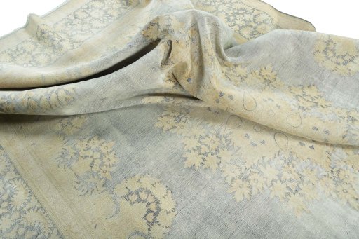 Surface texture of 1970s Vintage rug with natural Wool and intricate pattern