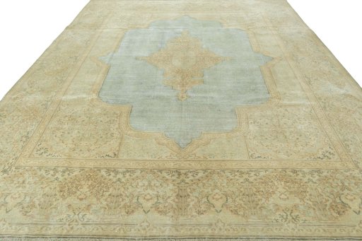 Surface texture of 1950s Vintage rug with natural Wool and intricate pattern