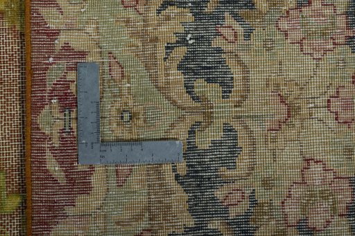 Backside of handmade 1950s Vintage rug showing knot structure and weave density