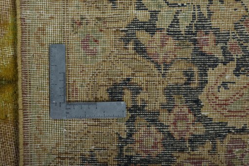 Backside of handmade 1950s Vintage rug showing knot structure and weave density