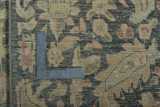 Backside of handmade 1970s Vintage rug showing knot structure and weave density