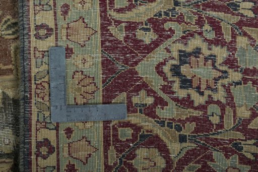 Backside of handmade 1950s Vintage rug showing knot structure and weave density