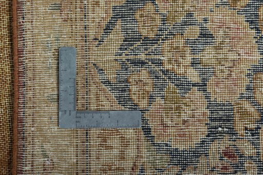 Backside of handmade 1950s Vintage rug showing knot structure and weave density