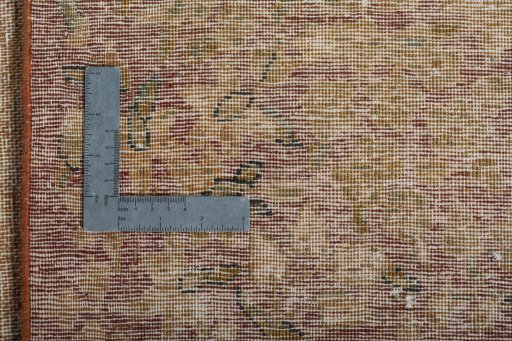 Backside of handmade 1950s Vintage rug showing knot structure and weave density