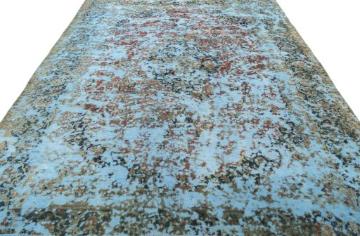 Surface texture of 1950s Vintage rug with natural Wool and intricate pattern
