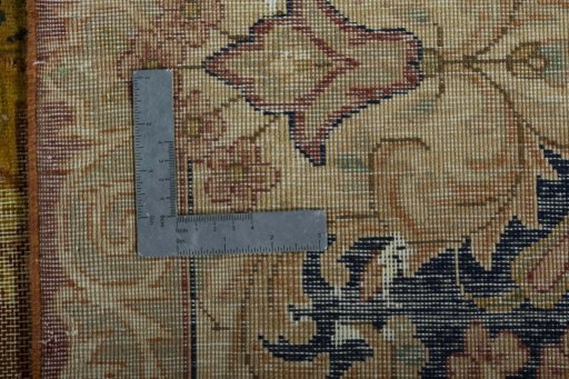 Backside of handmade 1950s Vintage rug showing knot structure and weave density
