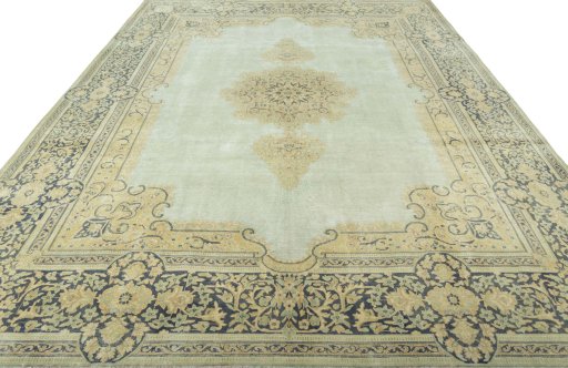 Surface texture of 1950s Vintage rug with natural Wool and intricate pattern