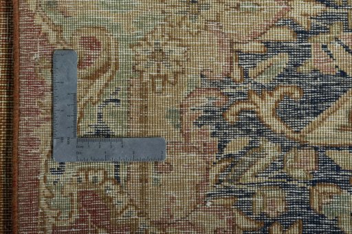 Backside of handmade 1950s Vintage rug showing knot structure and weave density