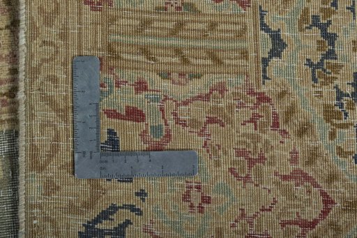 Backside of handmade 1950s Vintage rug showing knot structure and weave density