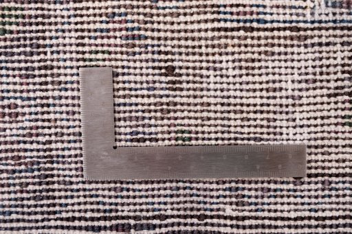 Close-up detail of 1950s Vintage rug from Iran / Persia showing Wool weave