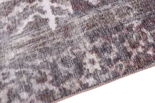 Backside of handmade 1950s Vintage rug showing knot structure and weave density