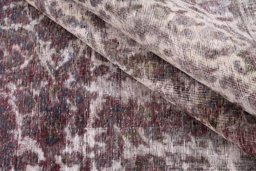 Corner detail of 1950s Vintage rug showing border pattern and Wool pile
