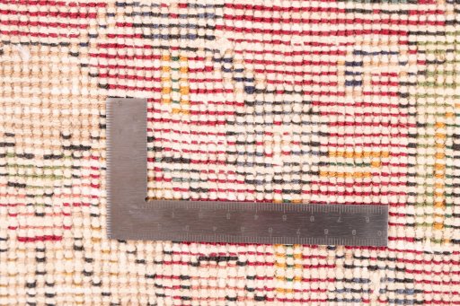 Surface texture of 1965s Vintage rug with natural Wool and intricate pattern