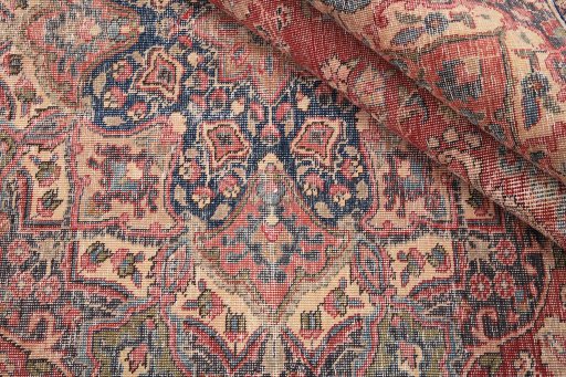 Close-up detail of 1980s Vintage rug from Iran / Persia showing Wool weave