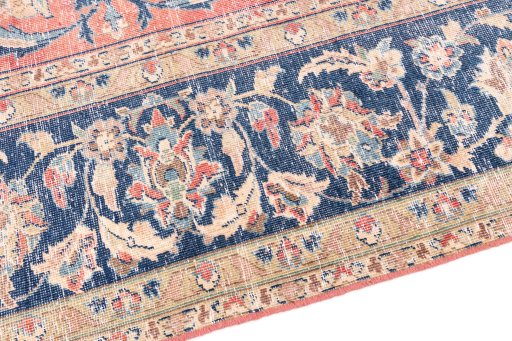 Backside of handmade 1950s Vintage rug showing knot structure and weave density