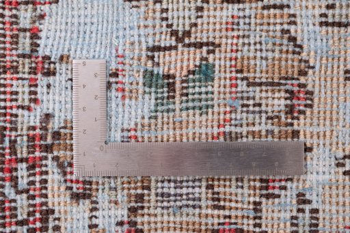 Surface texture of 1950s Vintage rug with natural Wool and intricate pattern