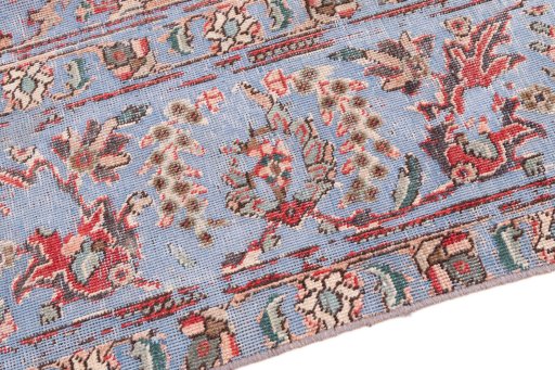 Backside of handmade 1950s Vintage rug showing knot structure and weave density