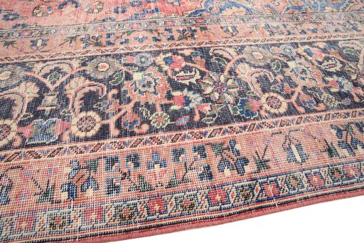 Backside of handmade 1970s Vintage rug showing knot structure and weave density