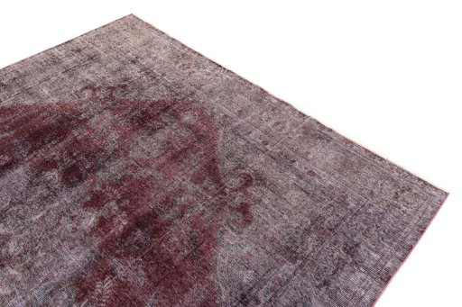 Surface texture of 1950s Vintage rug with natural Wool and intricate pattern