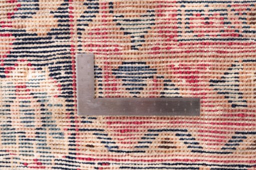 Close-up detail of 1950s Vintage rug from Iran / Persia showing Wool weave
